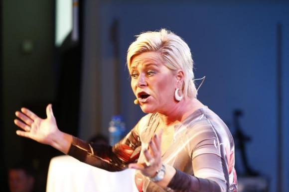 Jensen, leader of Norway's Fremskrittspartiet (Progress party), speaks to party members while waiting for the result of the general elections in Oslo