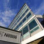 The Nestle logo is pictured on a truck outside the company's headquarters before the nine-month sale figures news conference in Vevey