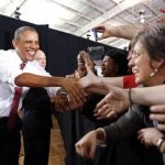 U.S. President Barack Obama shakes hands as he arrives to speak during a visit to North Carolina State University in Raleigh