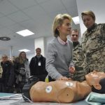 German Defence Minister von der Leyen takes part in a medical training for CPR on a dummy as she visits the field hospital at the ISAF camp in Mazar-i-Sharif