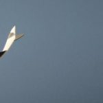 Virgin Galactic's SpaceShipTwo flies over the Mojave Desert shortly before successfully completing a test flight that broke the sound barrier