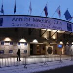 A person walks past the entrance of the congress centre for the annual meeting of the World Economic Forum (WEF) 2014 in the early morning in Davos