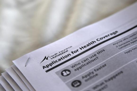 Applications are seen at a rally held by supporters of the Affordable Care Act in Jackson, Mississippi