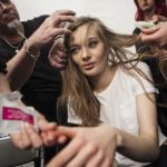 A model is made up before the BCBG Max Azria Fall 2014 collection during New York Fashion Week