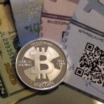 One of Bitcoin enthusiast Mike Caldwell's coins in this photo illustration at his office in Sandy, Utah