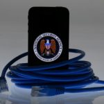 An illustration picture shows the logo of the U.S. National Security Agency on the display of an iPhone in Berlin