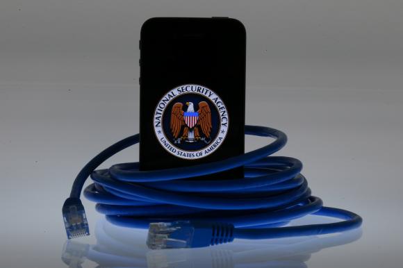 An illustration picture shows the logo of the U.S. National Security Agency on the display of an iPhone in Berlin