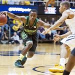 Baylor's Kenny Chery, left, drives by West Virginia's Gary Browne