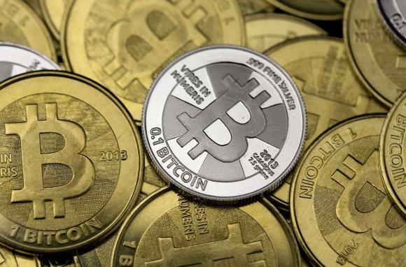 Some of Bitcoin enthusiast Mike Caldwell's coins are pictured at his office in this photo illustration in Sandy