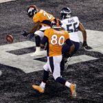 Denver Broncos' Knowshon Moreno (27) , Seattle Seahawks' Heath Farwell (55), teammate Julius Thomas (80)