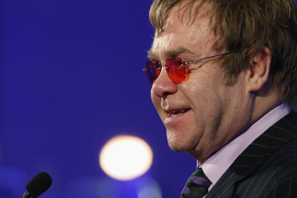 Elton John delivers remarks after receiving a lifetime achievement award for his philanthropic work from the Rockefeller Foundation in Washington