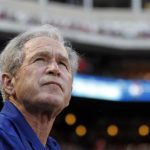 Former U.S. president George W. Bush watches before the start of the MLB American between the Rangers and White Sox in Arlington, Texas