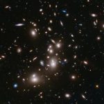 A long-exposure Hubble Space Telescope image of massive galaxy cluster Abell 2744 is seen in NASA handout