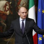 Italian Prime Minister Enrico Letta gestures during a news conference at Chigi Palace in Rome