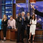 Jay Leno listens to Oprah Winfrey sing on his final night hosting "The Tonight Show with Jay Leno" in Burbank, California