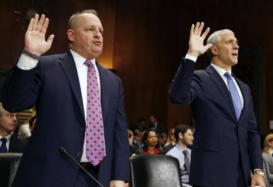 CFO of Target Mulligan and CIO at Neiman Marcus Kingston swear in on Capitol Hill in Washington
