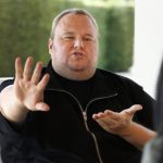 Kim Dotcom gestures as he speaks during an interview with Reuters in Auckland