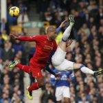 Liverpool's Johnson challenges Everton's Barkley during their English Premier League soccer match at Goodison Park in Liverpool