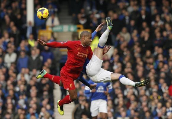 Liverpool's Johnson challenges Everton's Barkley during their English Premier League soccer match at Goodison Park in Liverpool