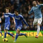 Manchester City's Negredo is challenged by Chelsea's Hazard during their English Premier League soccer match at the Etihad Stadium in Manchester