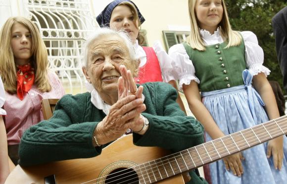 File photo of Maria von Trapp makes sitting with children in front of her former home Villa Trapp in Salzburg