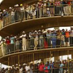 Miners gather to mourn their colleagues outside a shaft at Harmony Gold's Doornkop mine near Johannesburg
