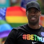 NBA player Jason Collins marches in the Gay Pride Parade in Boston