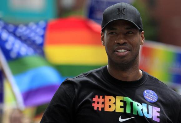 NBA player Jason Collins marches in the Gay Pride Parade in Boston