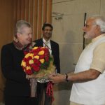 US ambassador to India Powell receives a bouquet from Hindu nationalist Modi during their meeting in Gandhinagar