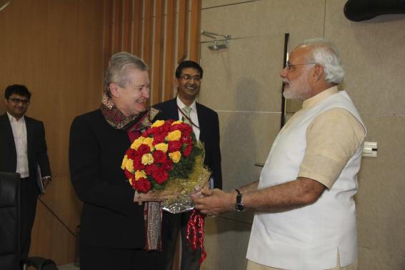 US ambassador to India Powell receives a bouquet from Hindu nationalist Modi during their meeting in Gandhinagar