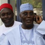 Nigeria's former vice president Abubakar makes a mobile phone call outside the venue of a closed-door screening exercise for the presidential candidates of the ruling People's Democratic Party in Abuja