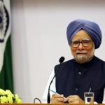Singh smiles during a news conference in New Delhi