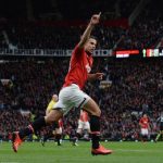 Manchester United's Van Persie celebrates scoring against Stoke City during English Premier League soccer match at Old Trafford Stadium in Manchester