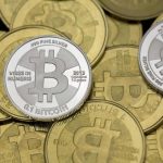 Some of Bitcoin enthusiast Mike Caldwell's coins are pictured at his office in this photo illustration in Sandy
