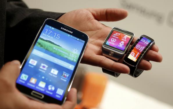 New Samsung Galaxy S5 smarphone, Gear 2 smartwatch and Gear Fit fitness band are displayed at the Mobile World Congress in Barcelona