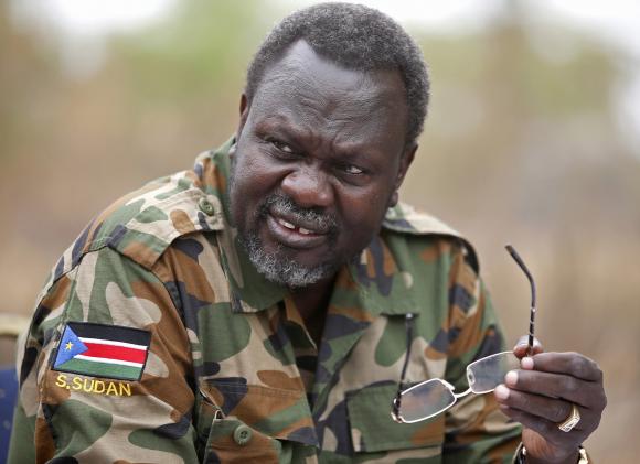 South Sudan's rebel leader Riek Machar speaks to rebel General Peter Gatdet Yaka in a rebel controlled territory in Jonglei State