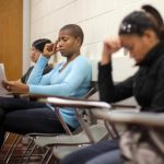 Students listen to professor Christian Agunwamba during their "Fundamentals of Algebra" class at Bunker Hill Community College in Boston