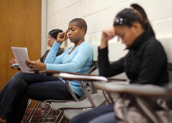 Students listen to professor Christian Agunwamba during their "Fundamentals of Algebra" class at Bunker Hill Community College in Boston