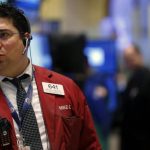 Traders work on the floor of the New York Stock Exchange