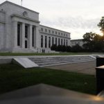Sun rises to the east of the U.S. Federal Reserve building in Washington