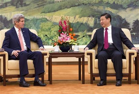 U.S. Secretary of State John Kerry, left, meets with Chinese President Xi Jinping