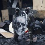 Anti-government protesters are seen at the barricades in Kiev