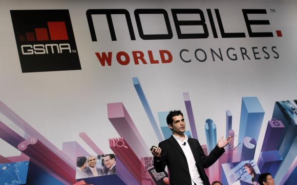 File photo of Viber's Founder and CEO Marco gesturing during a news conference at the Mobile World Congress in Barcelona