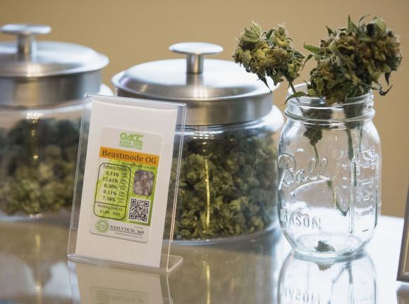 Jars of marijuana strain "Beast Mode OG" are pictured in Johnson's Queen Anne Cannabis Club in Seattle, Washington