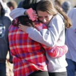 students comfort each other outside of Arapahoe High School