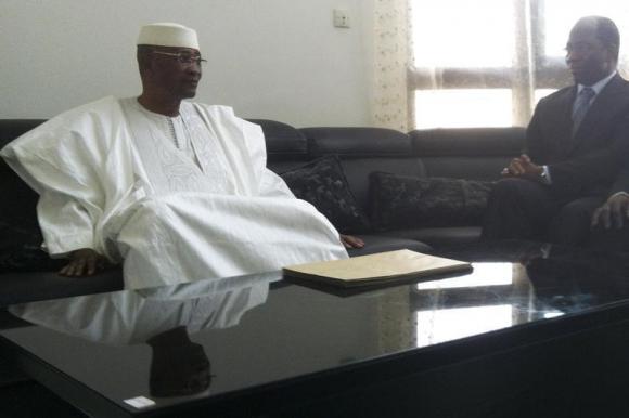 Mali's ousted President Toure attends a meeting in which he resigned in Bamako