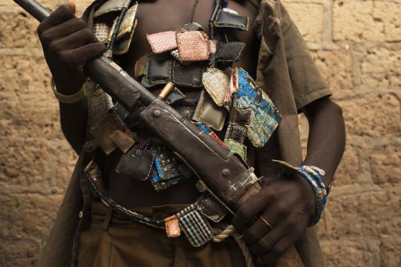 An anti-balaka militiaman poses for photograph on outskirts of capital Bangui