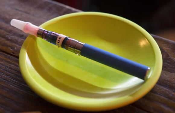 An e-cigarette sits in a tray on the bar at the Henley Vaporium in New York City