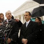 Attorney Paul Clement speaks to the press next to attorney Dave Cortman on the steps of the Supreme Court in Washington