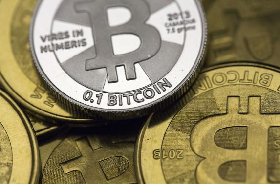 Bitcoin enthusiast Mike Caldwell's coins are pictured at his office in this photo illustration in Sandy